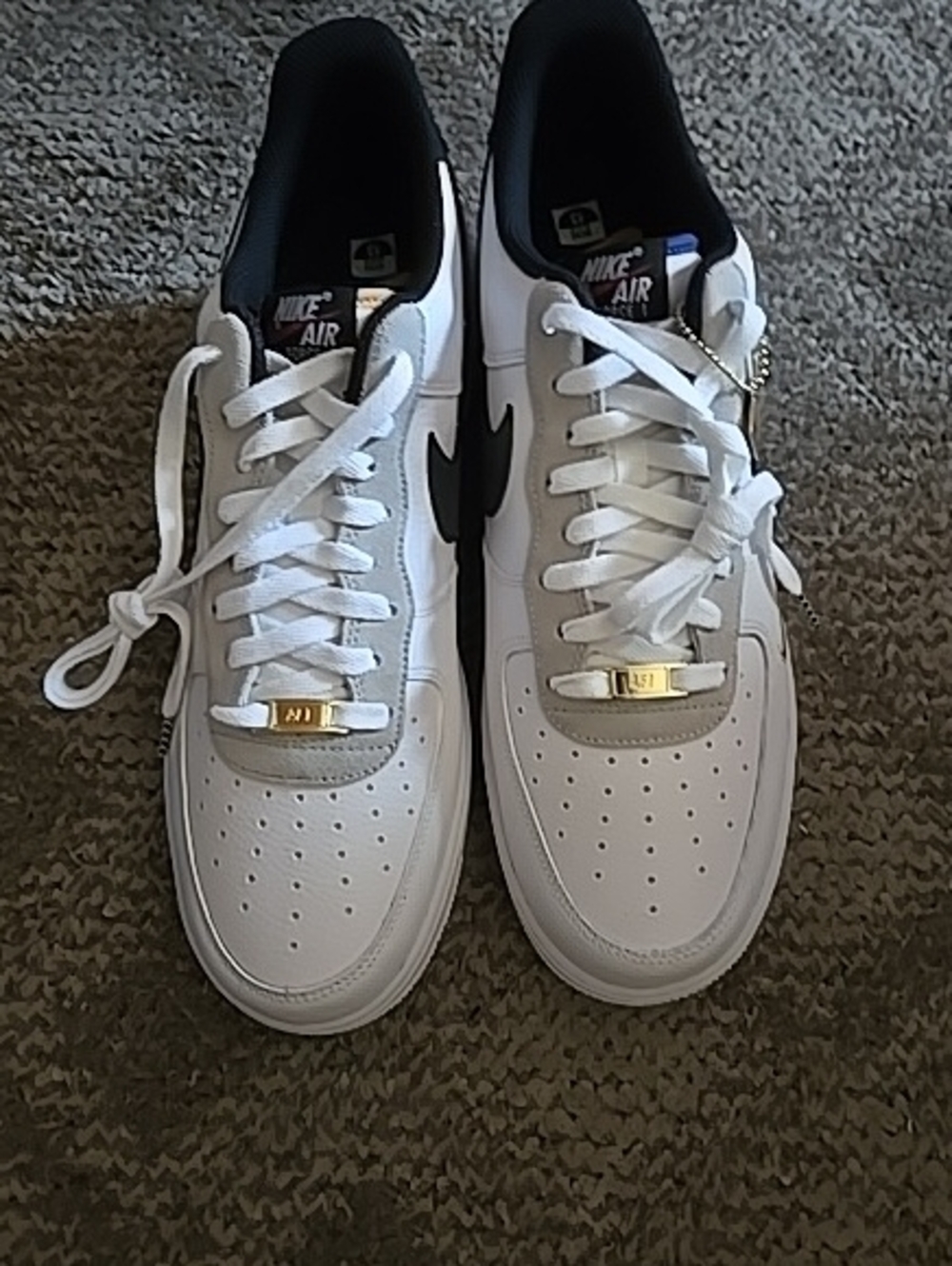 Nike White and Black Low-Top Sneakers with Gold Accents
